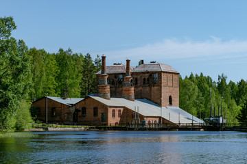 Fototapeta na wymiar Old brick building of a closed down steel mill in Sweden