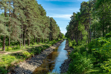 Obraz premium Summer view of a boat canal in Sweden, low on water
