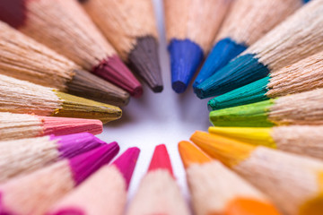 Macro top of colored pencils in a round