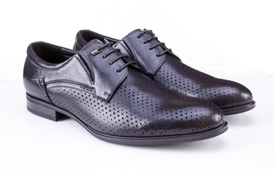 Black leather men's shoes on white background