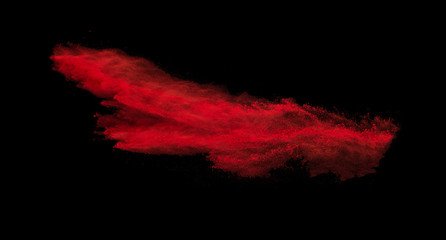 Explosion of colored powder on black background