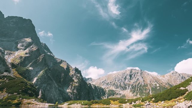 Tatra National Park, Poland. Calm Lake Czarny Staw under Rysy And Summer Mountains Landscape. Beautiful Nature, Scenic View Of Five Lakes Valley. UNESCO World Heritage Site.