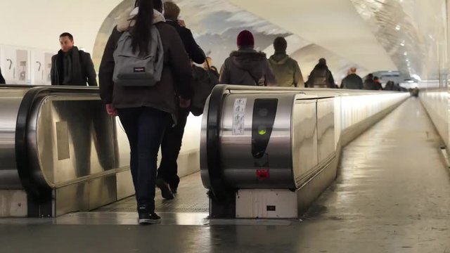 Metro Paris, People on crossing Escalators