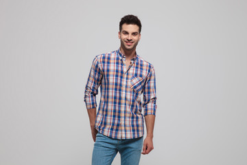 Fototapeta premium portrait of smiling casual man wearing shirt with blue checkers