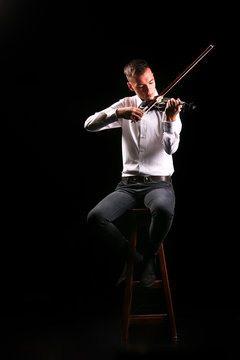 Young men playing the violin