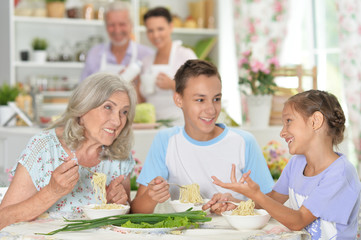 Close up portrait of big happy family having breakfast