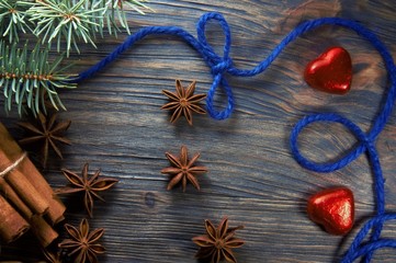 Christmas concept with spices blue thread an heart