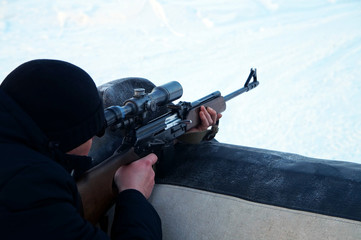 Partisan aims at an assault rifle sight