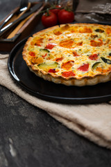 VEGETABLE PIE WITH CHERRY TOMATOES, GRILLED PEPPERS AND COURGETTES With fresh eggs and fresh cream