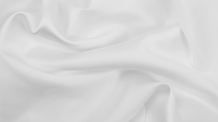 Smooth elegant white silk or satin luxury cloth texture as wedding background. Luxurious background design