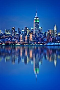 New York skyline with water reflections  at night