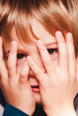 little child with hands on the face  - sensory connections
