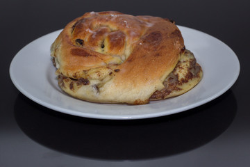 freshly baked Copenhagen on white plate isolated on black 