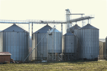 Fototapeta na wymiar Grain silo plant unit dehydrate agricultural store corps corn agricultural