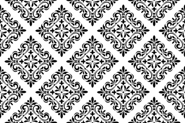 Wallpaper in the style of Baroque. Seamless vector background. White and black floral ornament. Graphic pattern for fabric, wallpaper, packaging. Ornate Damask flower ornament