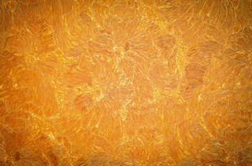 Golden background or texture. Wallpaper on the wall. Element of design.