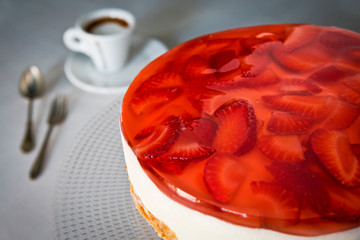 Cheesecake with strawberries with espresso coffee