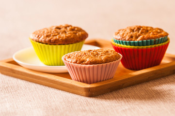 Tasty cupcakes on table in kitchen