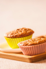 Tasty cupcakes on table in kitchen