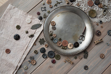 Retro sewing accessories and accessories for needlework. Reels of thread, pins, buttons, ribbons on white boards. Copy spase. 