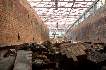 Abandoned birck factory ruins corridor