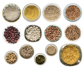 Various cereals, seeds, beans, peas on plates isolated on white background, top view.