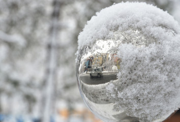 silver christmas glass ball in the snow