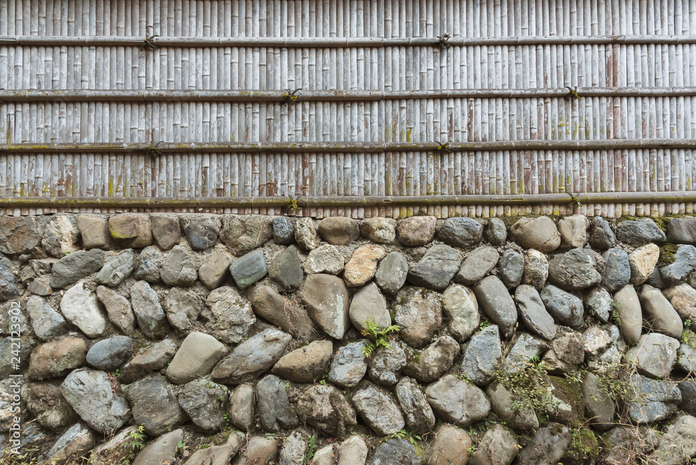 Aufkleber stone wall and bamboo fence for pattern and background