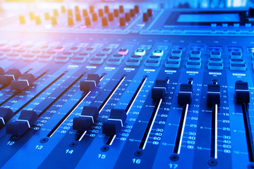 Professional audio studio sound mixer console board panel with recording , faders and adjusting...