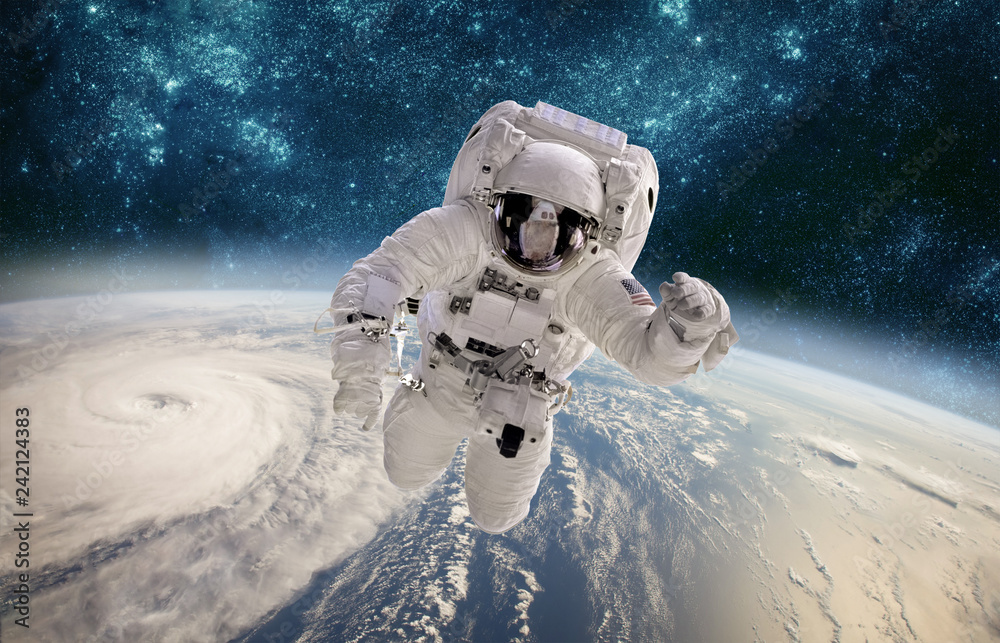 Sticker astronaut in outer space against the backdrop of the planet earth. typhoon over planet earth.