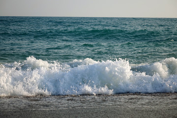 Pebble beach and blue sky on background
