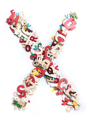 Colorful wood alphabet letters on white background,letter X