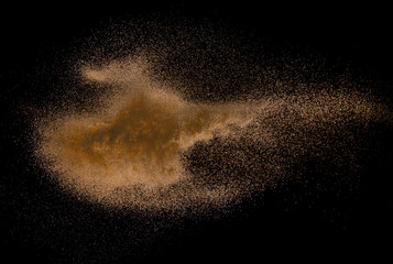 Fototapeta na wymiar Sandy explosion isolated on over dark background,Abstract sand cloud,Motion blur