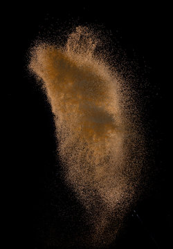 Sandy explosion isolated on over dark background,Abstract sand cloud,Motion blur