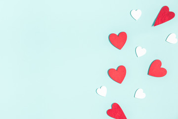 Valentine's Day background. White and red hearts on pastel blue background. Valentines day concept....