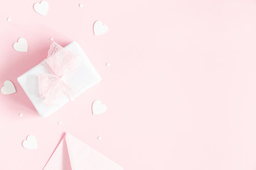 Valentine's Day background. Gift box on pastel pink background. Valentines day concept. Flat lay,...