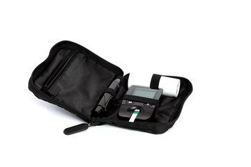 Glucometer and test strip lies in bag case on a white background
