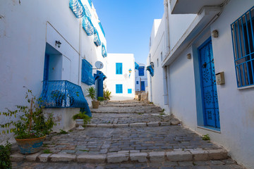 Fototapeta premium Cityscape with typical white blue colored houses in resort town Sidi Bou Said. Tunisia.