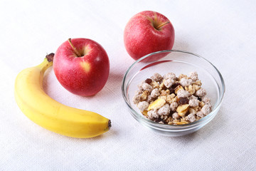 Healthy food with Corn Flakes cereal in a bowl, apple, banana and glass with milk. Morning breakfast.