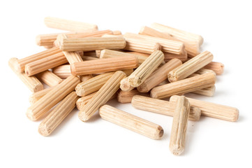 Wooden dowel pins on white backgroun