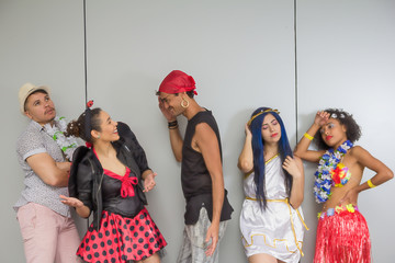 Carnaval party. Crowd of Brazil people in costume in Carnival. Dressed brazilian revelers having...