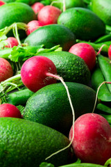 Pile of fresh raw ripe red radishes peas avocados. Organic produce balanced diet vegan healthy lifestyle concept. Vibrant colors. Food poster