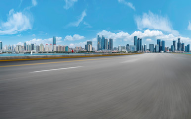 Empty asphalt road along modern commercial buildings in China,s cities