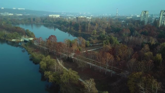 Aerial footage over Echo Park Lake, Kishinev, Moldova republic of. View of lake and smille bridge.
