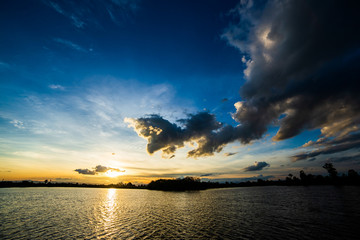 colorful dramatic sky with cloud at sunset.