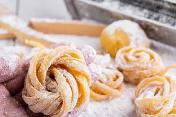 pasta with pasta ingredients on the dark wooden table top view