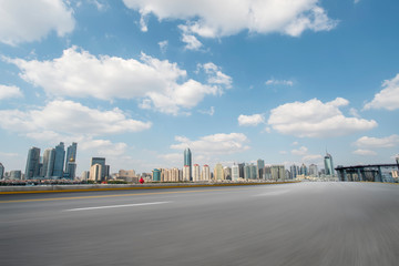 Empty asphalt road along modern commercial buildings in China,s cities