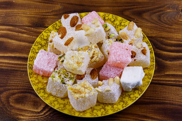Turkish delight in a plate on wooden table