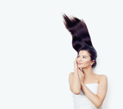 Pretty Woman With Beautiful Healthy Hair Blowing Up On White Background. Emotion, Expressive Facial Expression, Hair Care Concept