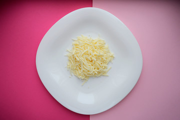 Mozzarella cheese in a bowl, top view